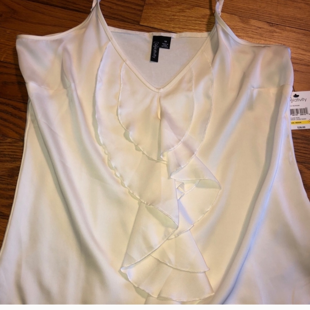Lightweight slightly sheer top with adjustable straps.
